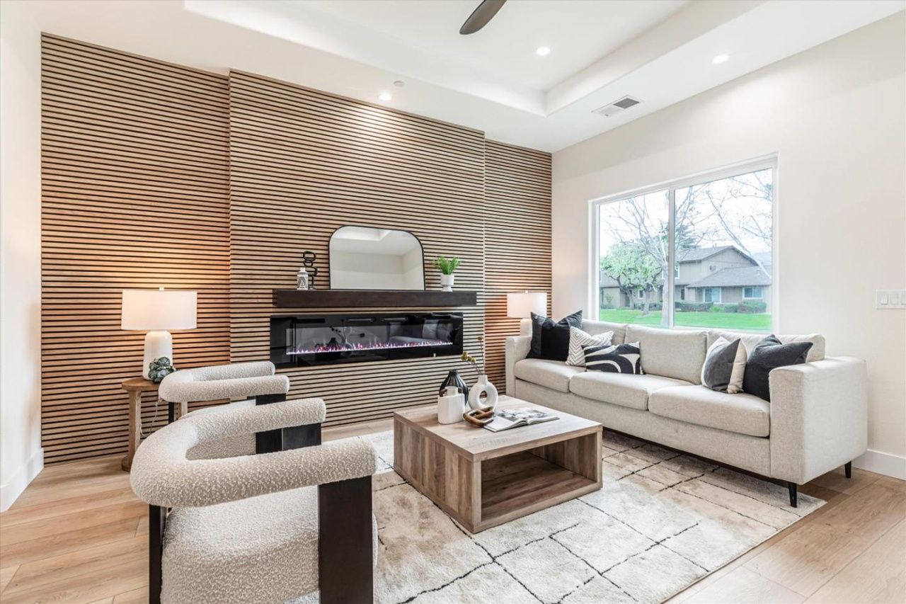 Living room with full-height oak slat wall and linear fireplace